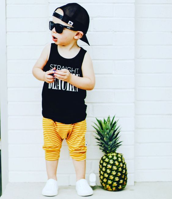 fashionable toddler boy in tropical style outfits 