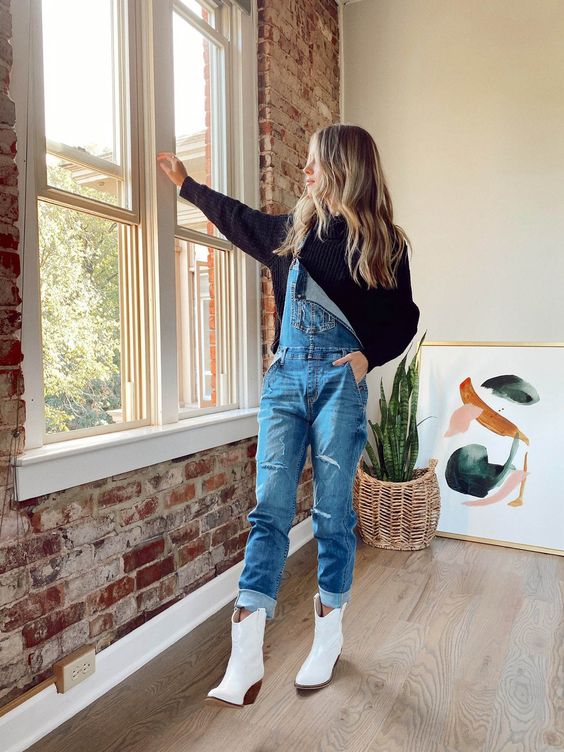 lightweight sweatshirt and loose denim overalls